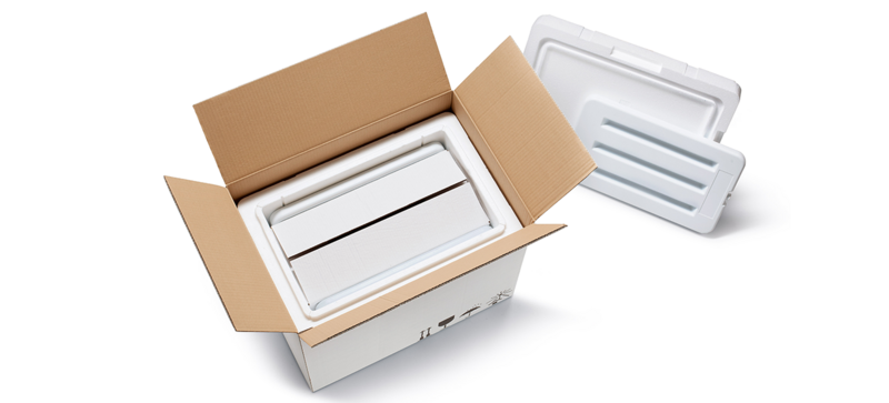 A cardboard box with a white insulated box and a further inner carton and cooling elements 