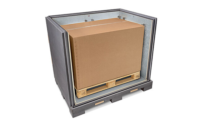 A grey insulated container with an inner carton and cooling elements on a pallet 