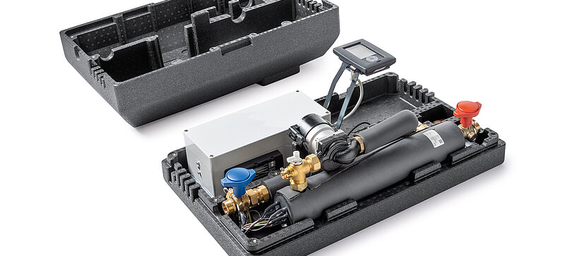 
		  A man standing in front of a heating control panel