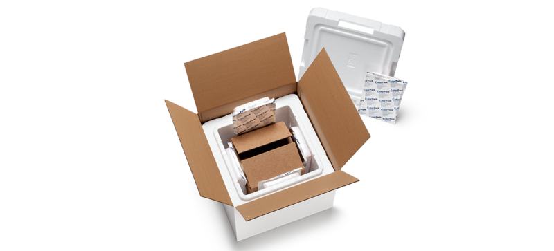 A cardboard box with a white insulated box and a further inner carton and cooling elements 
