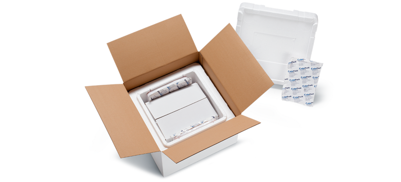 A cardboard box with a white insulated box and a further inner carton and cooling elements (*)